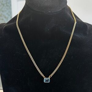 TOVA - Light Blue Emerald Cut Crystal Pendant Necklace on Gold Tone Chain